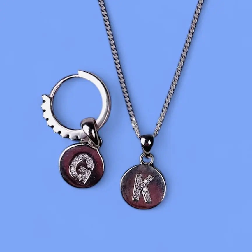 Berlock - Bokstavsbricka med Zirkoner i Gulddouble - L8Hasselblad