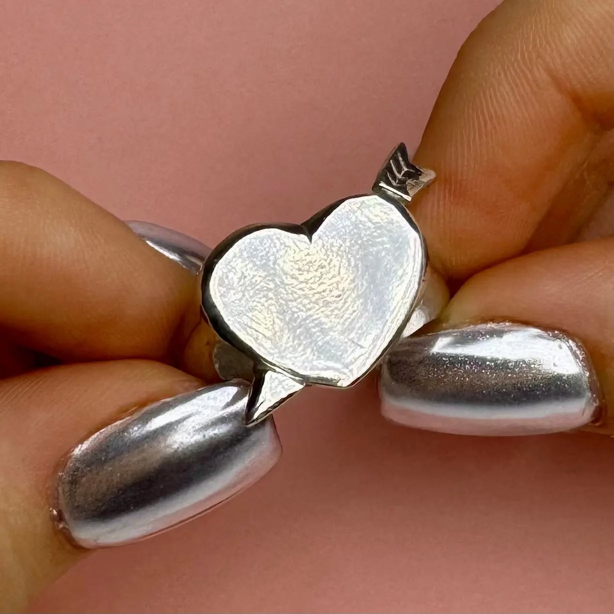 Hjärtklackring med pil L8Hasselblad