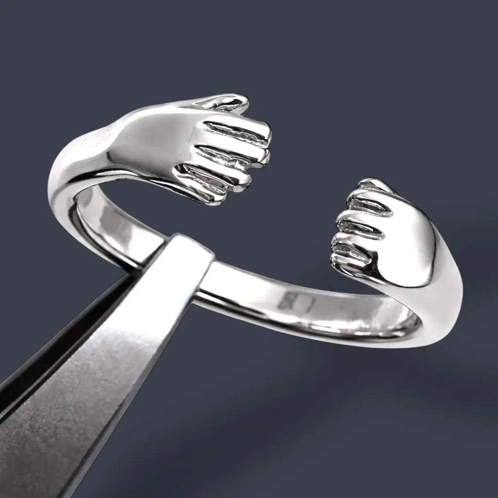 Kramen ring / öppen knuten hand L8Hasselblad