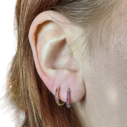 Between rings with zircons earring