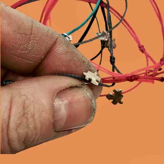 Wire bracelet with puzzle piece